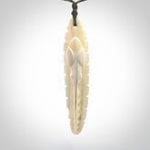 This is a hand carved bone contemporary warthog tusk pendant. Yuri Terenyi has carved this from warthog tusk. It is a delightful, large and artistic piece of jewellery. One only necklace.